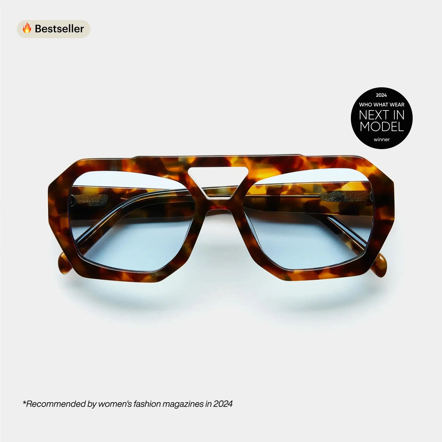 A pair of sunglasses with a patterned frame displayed against a white background, with a 'Bestseller' label and a recommendation from a women's fashion magazine.