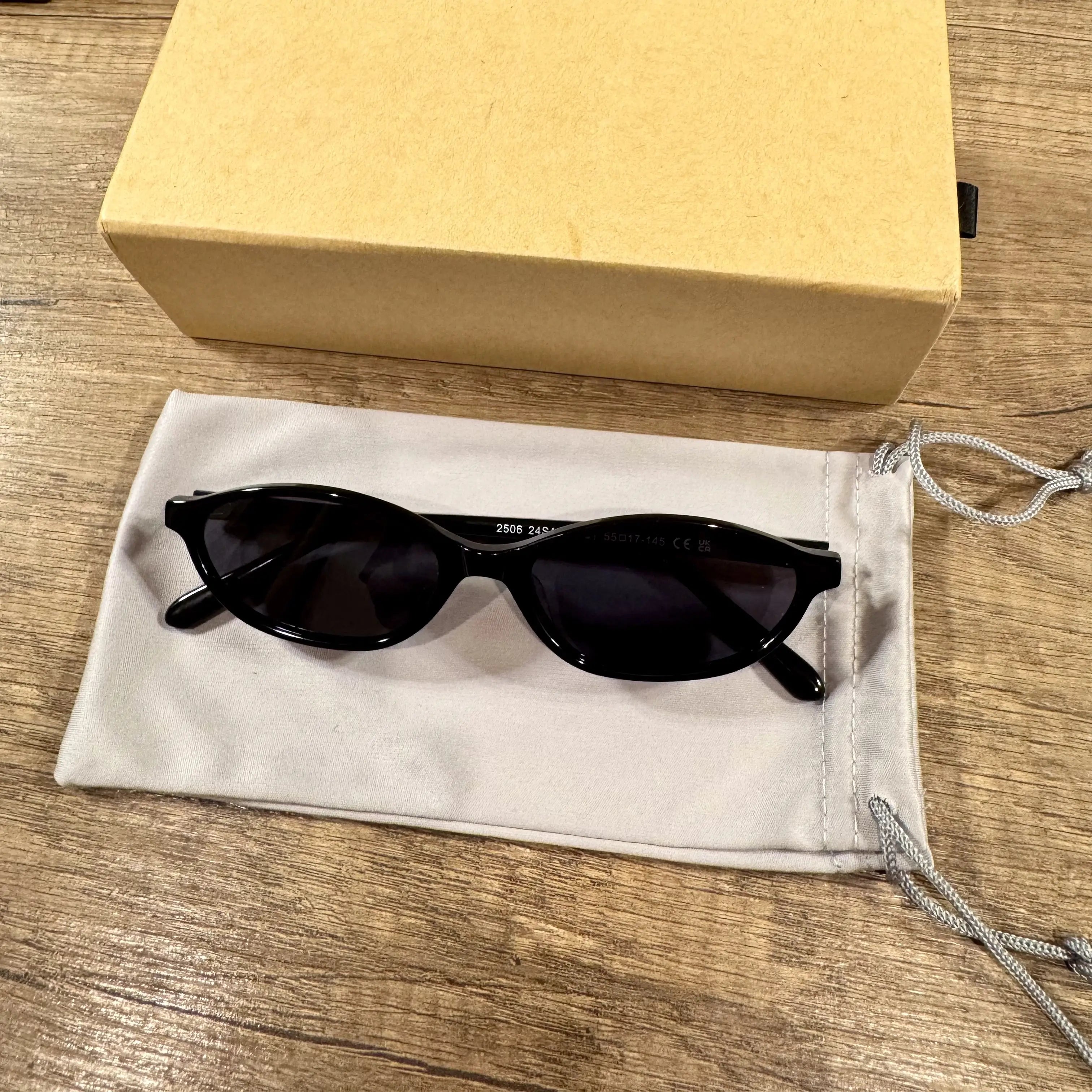 Black cat-eye sunglasses on a white background